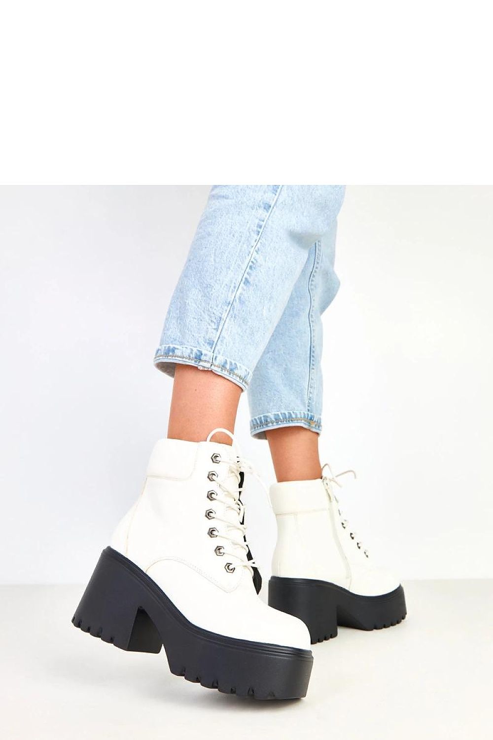 Solea's modern ankle boots for women in eco-friendly leather, showcasing a bold 12cm shaft and elegant square toe.
