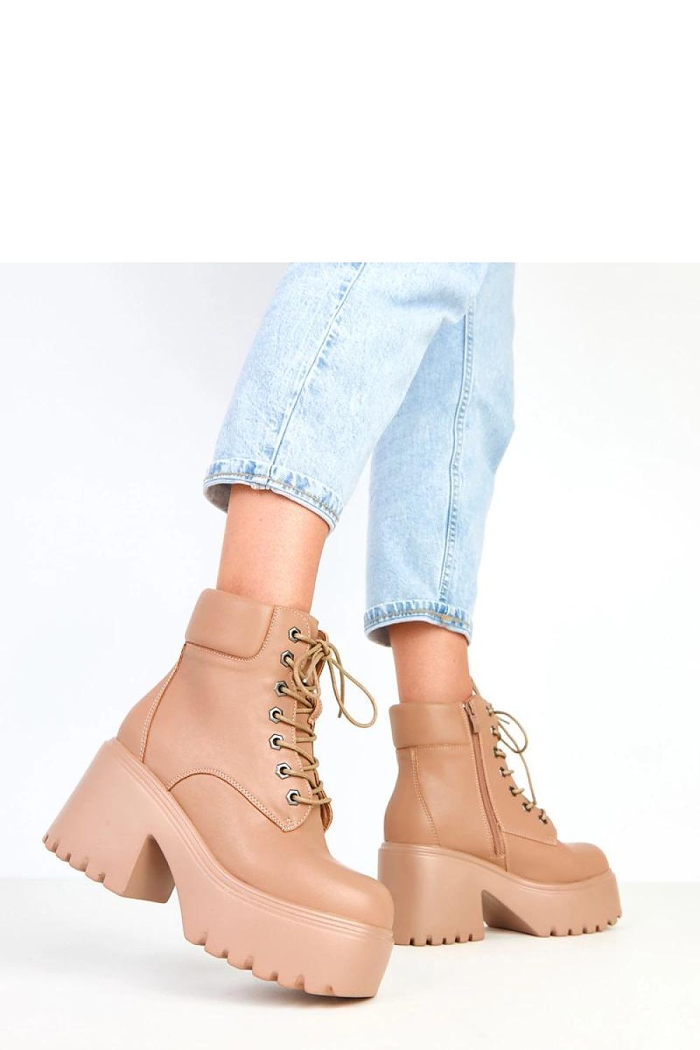 Elegant chunky ankle boots by Solea, featuring a bold square toe and unlined fabric interior, ideal for enhancing transitional season outfits.