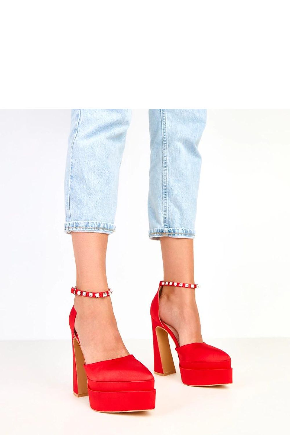 Close-up of Solea satin heel pumps showcasing the exquisite zircon-buckle strap and delicate craftsmanship, ideal for formal events.