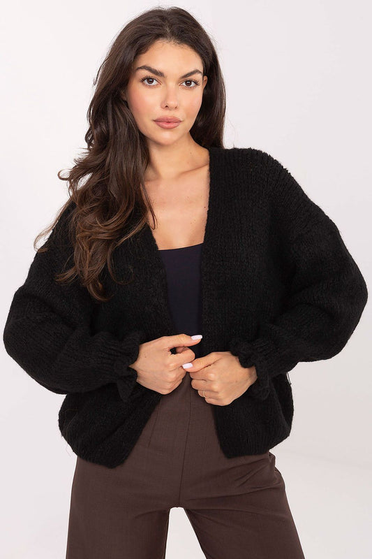 Elegant Rue Paris women's cardigan featuring delicate ruffle sleeves, crafted from a soft acrylic-wool blend, perfect for luxurious everyday wear.
