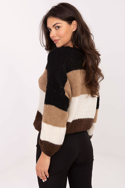 Elegant oversized women's sweater by Rue Paris, highlighting the blend of soft yarns and trendy striped pattern.