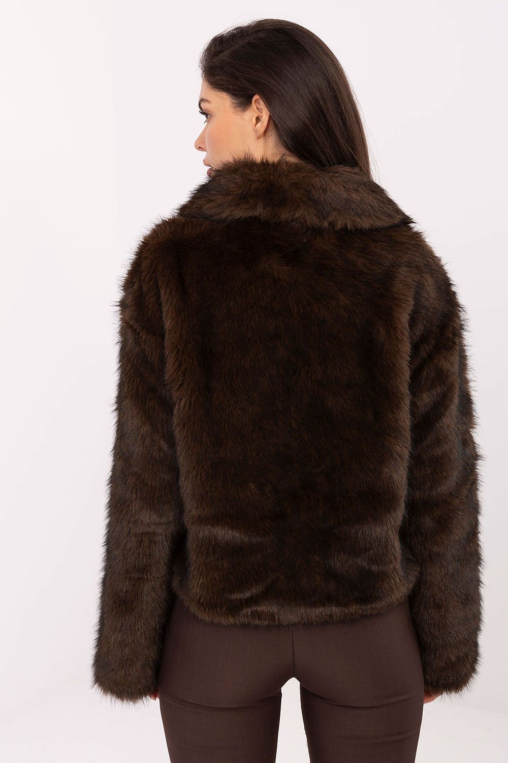Model wearing the chic Rue Paris women's fur jacket with wide collar, fitted silhouette, and practical pockets, ideal for upscale casual and formal occasions.