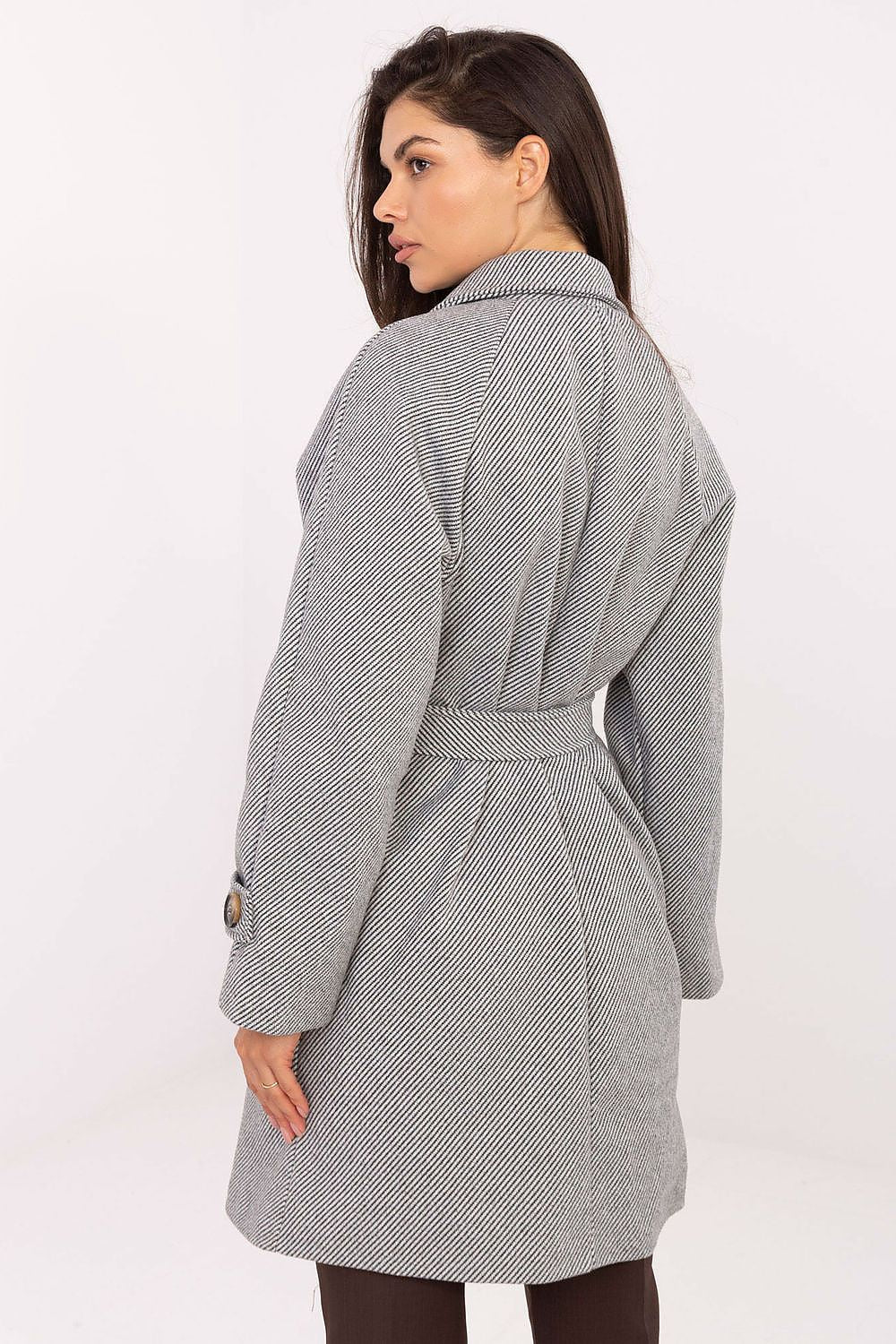 Model wearing the elegant Rue Paris women’s transitional coat, showcasing its refined design and comfort during a casual outing in autumn.