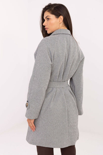 Model wearing the elegant Rue Paris women’s transitional coat, showcasing its refined design and comfort during a casual outing in autumn.