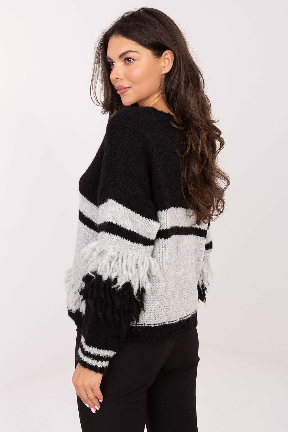 Italy Moda's women's cardigan displayed with long sleeves and unique fringes, embodying modern luxury and comfort.