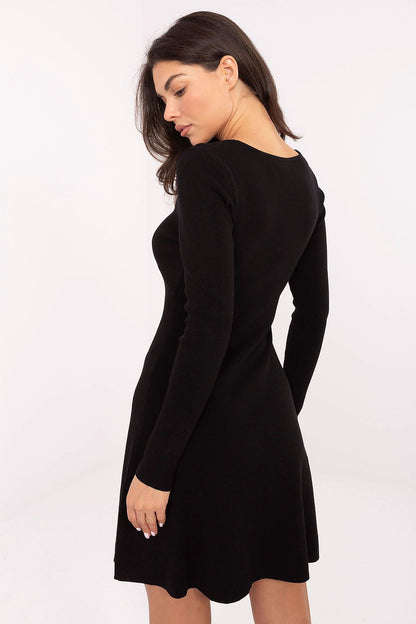 Model wearing the elegant knitted mini dress with long sleeves, perfect for day-to-night wear, exclusively from Factory Price.