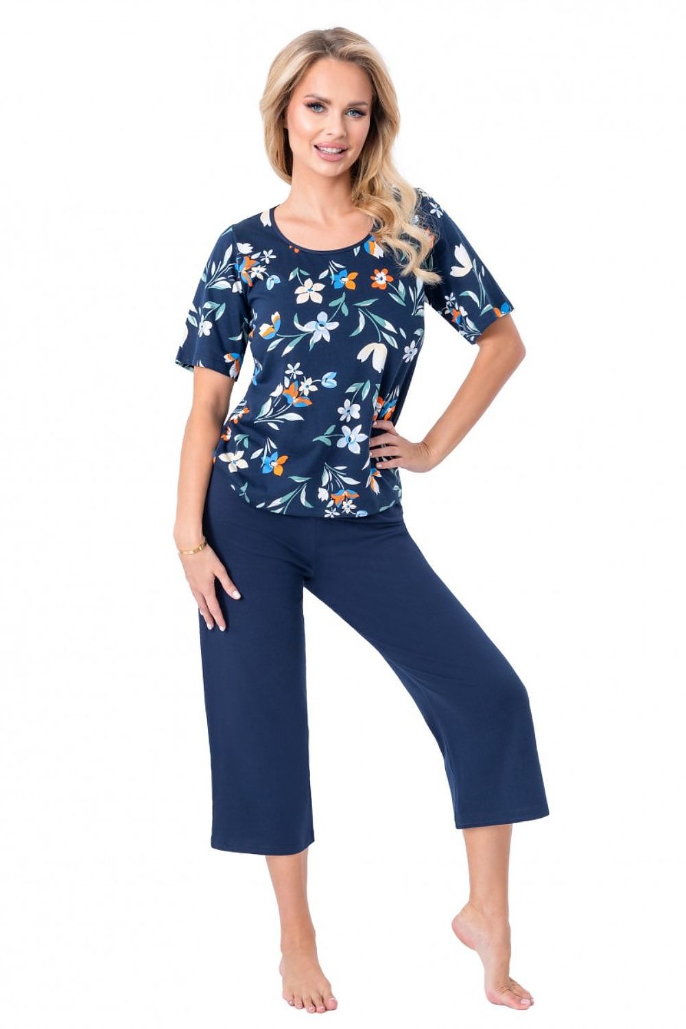 Elegant 100% cotton pajama set for women by Donna featuring a stylish 3/4 sleeve blouse with floral motif and classic 3/4 length navy blue pants, perfect for luxurious comfort.