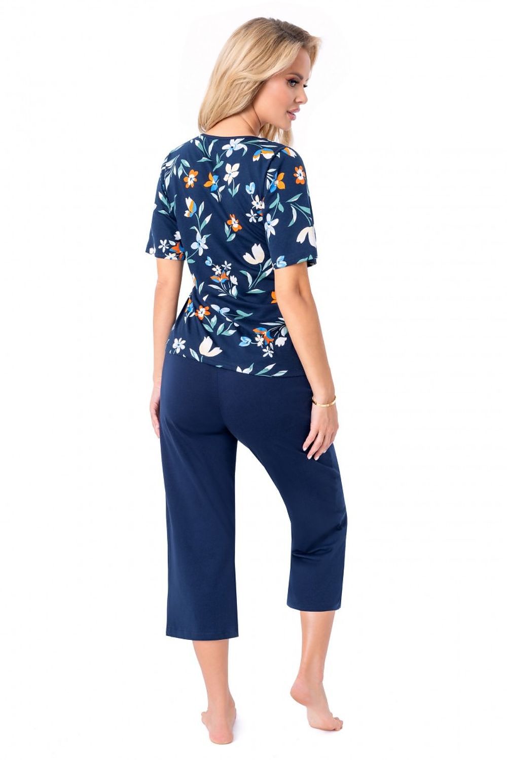 Close-up view of Donna's luxurious 100% cotton pajama set, highlighting the delicate floral design on the blouse and the soft fabric of the 3/4 length pants.