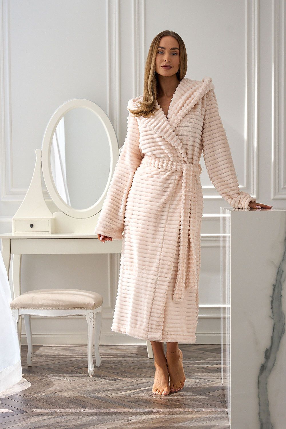 Luxury women's quilted bathrobe with hood, pockets, and waist tie from L&L Collection, crafted for comfort and elegance in sizes S-XL.
