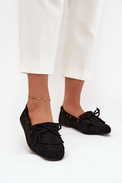 Luxury women's eco-suede moccasin loafers by Step in Style featuring decorative fringes and a sophisticated bow design, perfect for stylish everyday wear.