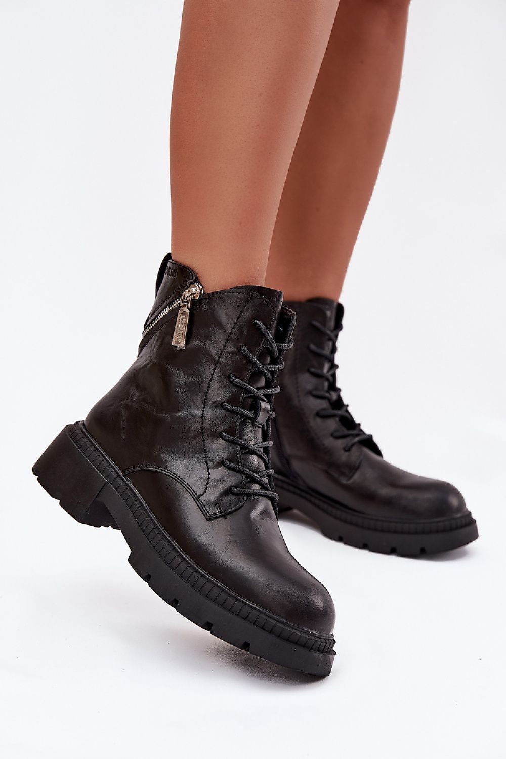 Fashionable urban look of Step in Style women's work boots with practical lacing and decorative zippers, perfect for sophisticated styles.