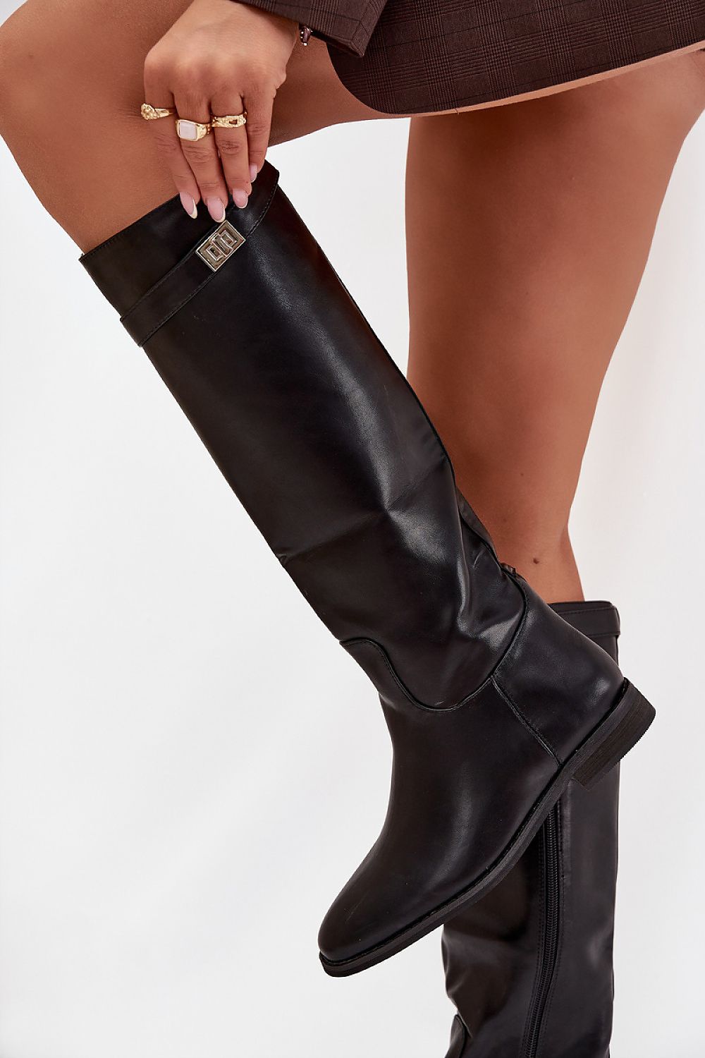 Stylish women's thigh-high boots in eco leather with flat heels, designed by Step in Style, ideal for pairing with dresses or pants for a chic winter look.
