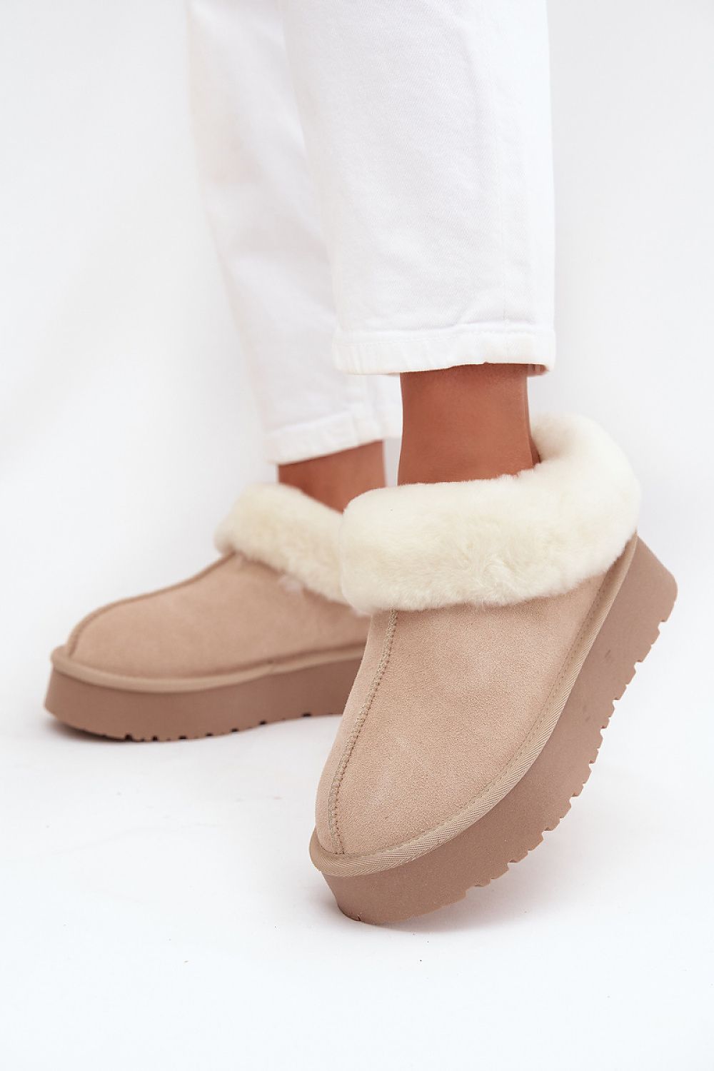 Stylish winter footwear from Step in Style featuring luxury suede material and soft fur lining for ultimate comfort.