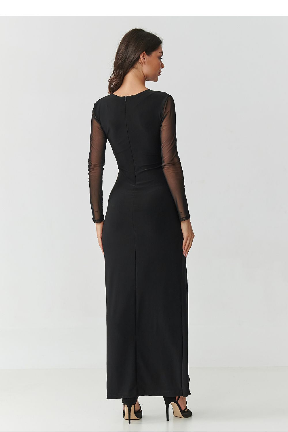 Graceful black maxi dress with front slit and ruffle accent by Makadamia, ideal for weddings and elegant dinners.