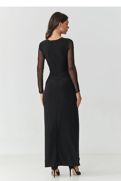 Graceful black maxi dress with front slit and ruffle accent by Makadamia, ideal for weddings and elegant dinners.