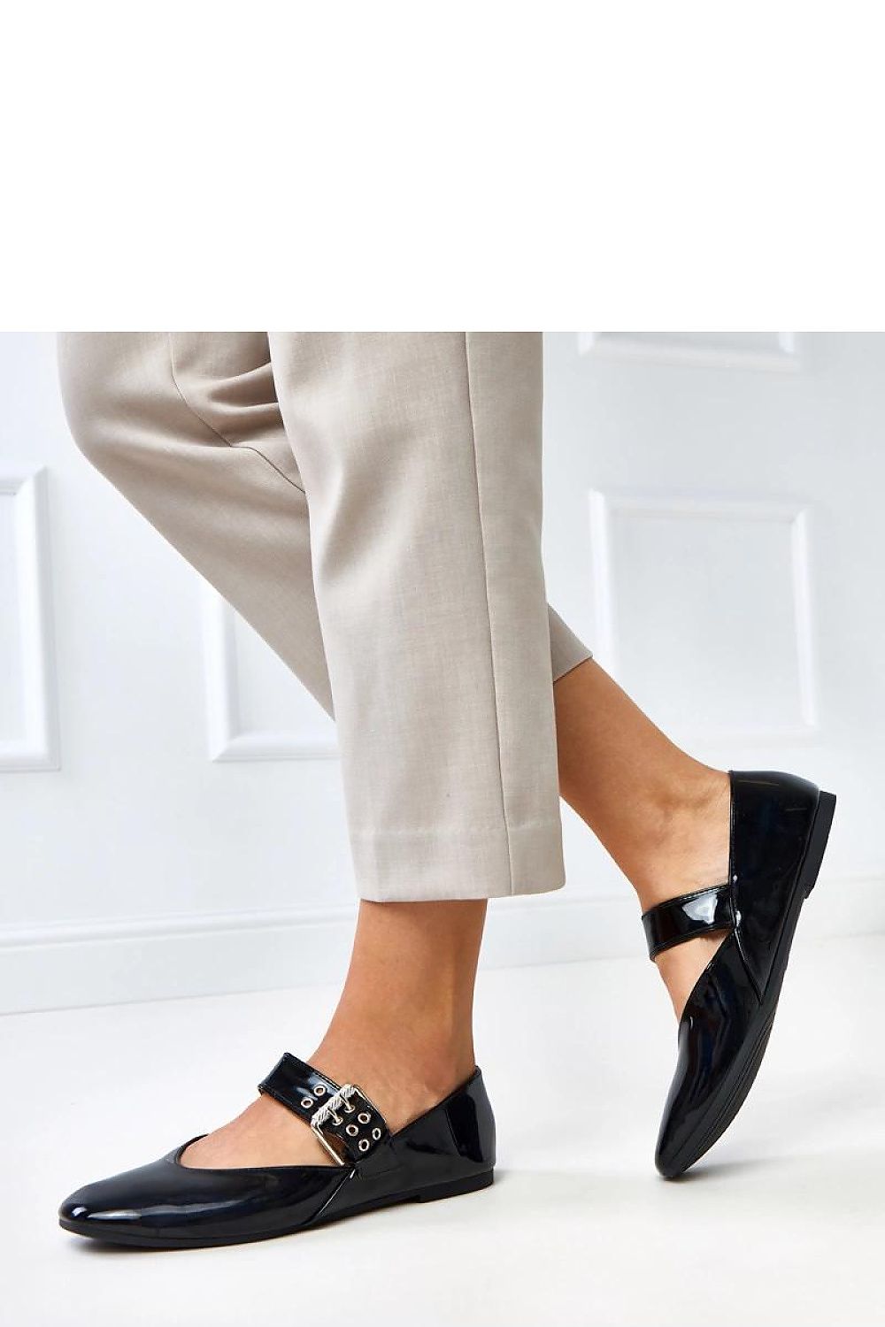 Close-up view of Solea square toe ballet flats with decorative buckle, crafted from soft patent eco-leather.