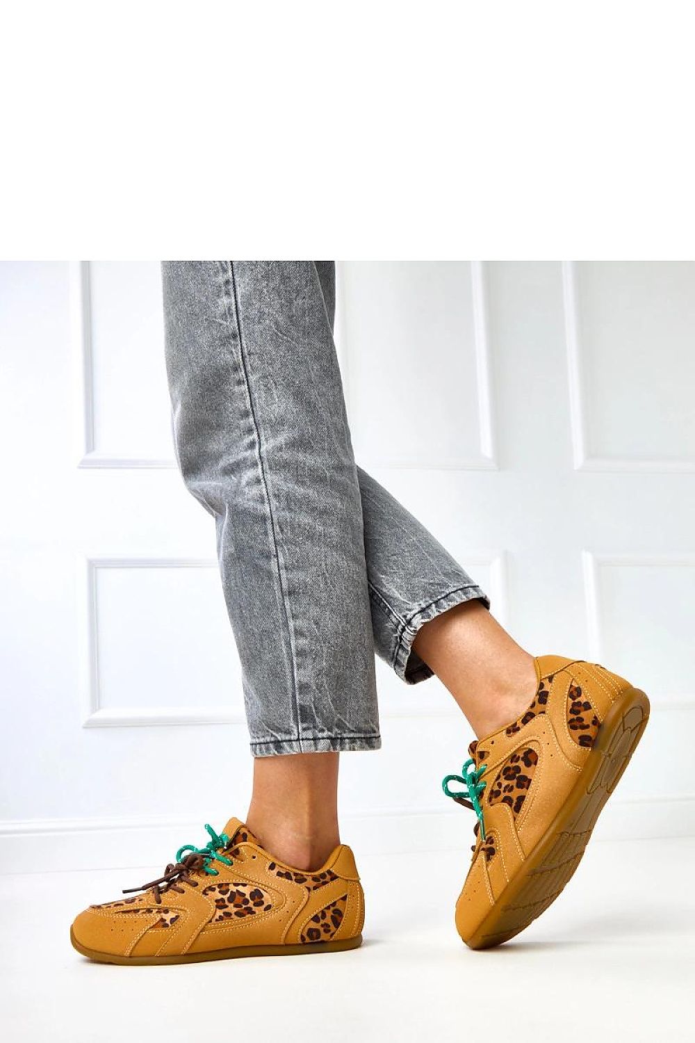 Solea eco-friendly suede sport shoes featuring a stylish white accent, perfect for upscale casual wear.