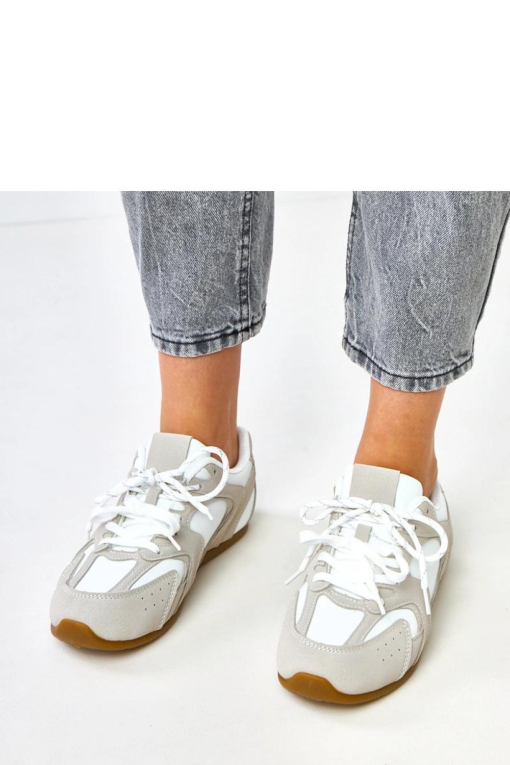 Close-up of Solea eco-friendly suede sport shoe showcasing intricate laces and premium quality materials.