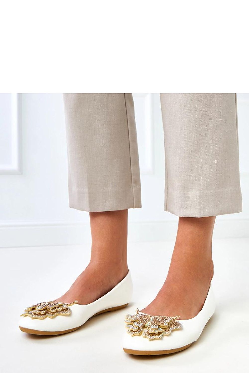 Charming Solea women's ballet flats in a fashionable design, featuring a decorative butterfly and eco leather finish, ideal for both casual and elegant settings.