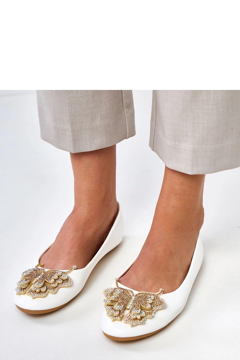 Close-up of Solea women's ballet flats featuring intricate butterfly design adorned with zircons, enhancing the elegance and sophistication of the footwear.