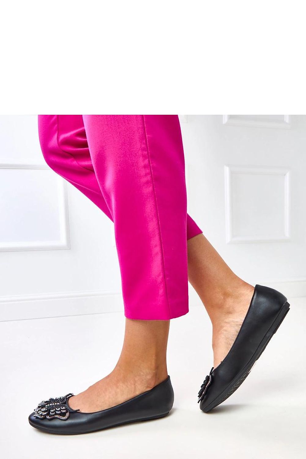 Charming Solea women's ballet flats in various sizes, featuring a decorative butterfly design, showcasing the perfect blend of comfort and luxury in women's footwear.