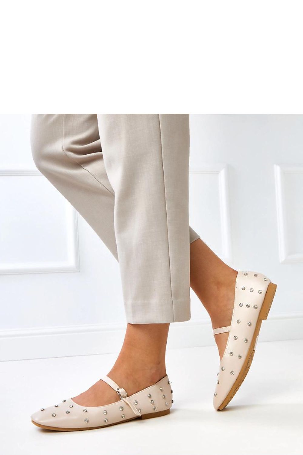 Close-up of Solea's eco-leather ballet flats adorned with decorative crystals, emphasizing luxury and comfort for elegant wear.