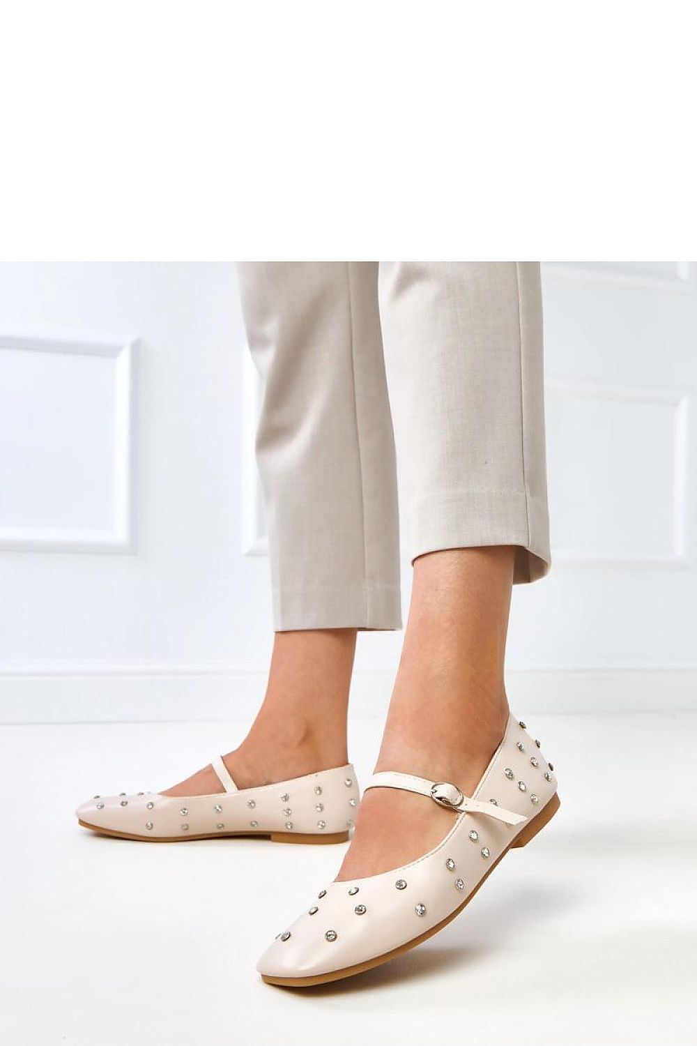 Stylish display of Solea's eco-leather ballet flats with crystal detailing, highlighting their versatility and timeless elegance.