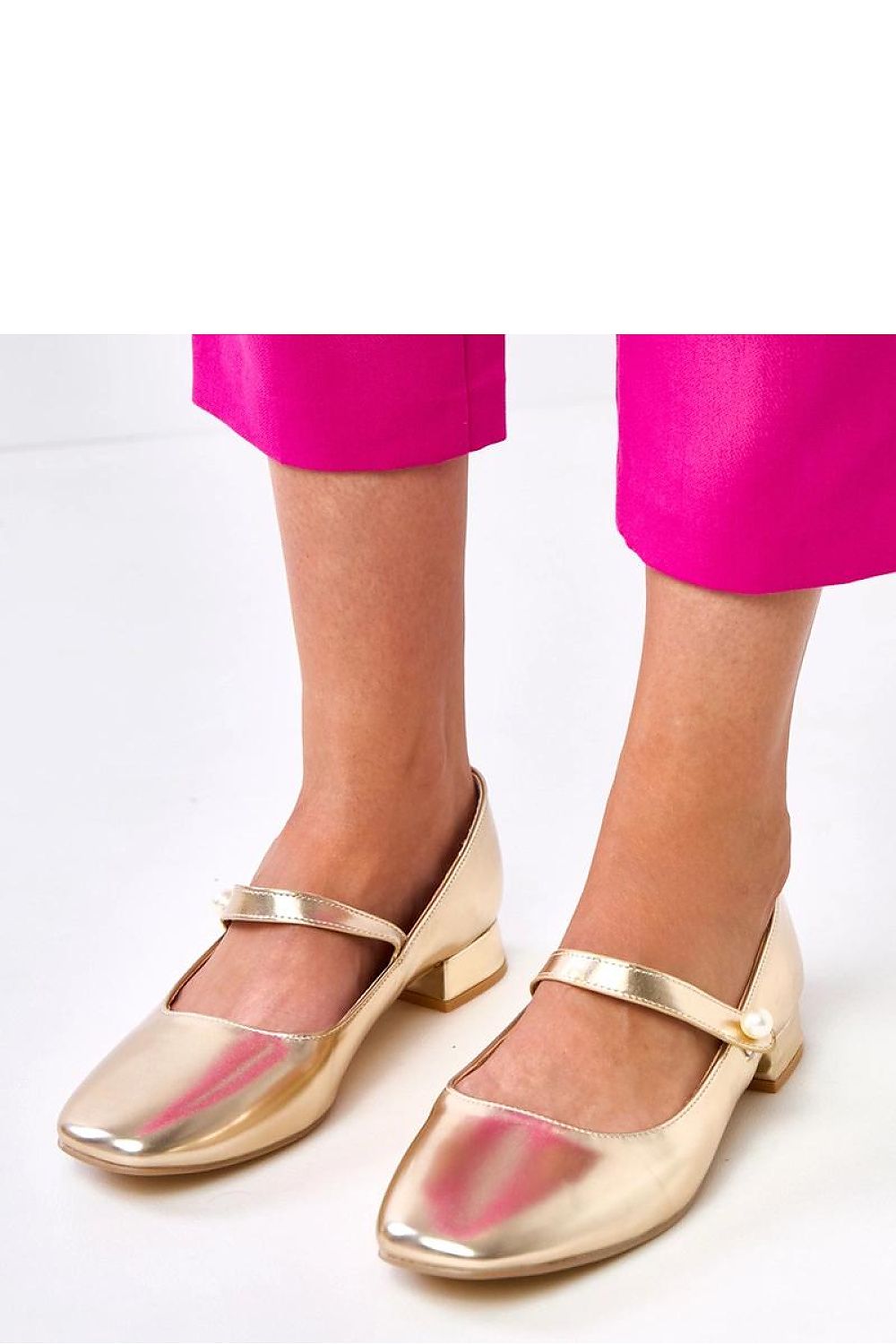 Close-up view of Solea's eco-leather pumps with decorative pearl strap, showcasing luxurious design and comfort.