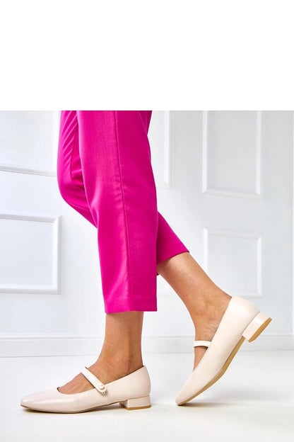 Close-up of Solea's eco-leather pumps, showcasing the luxurious pearl strap design and round toe comfort.