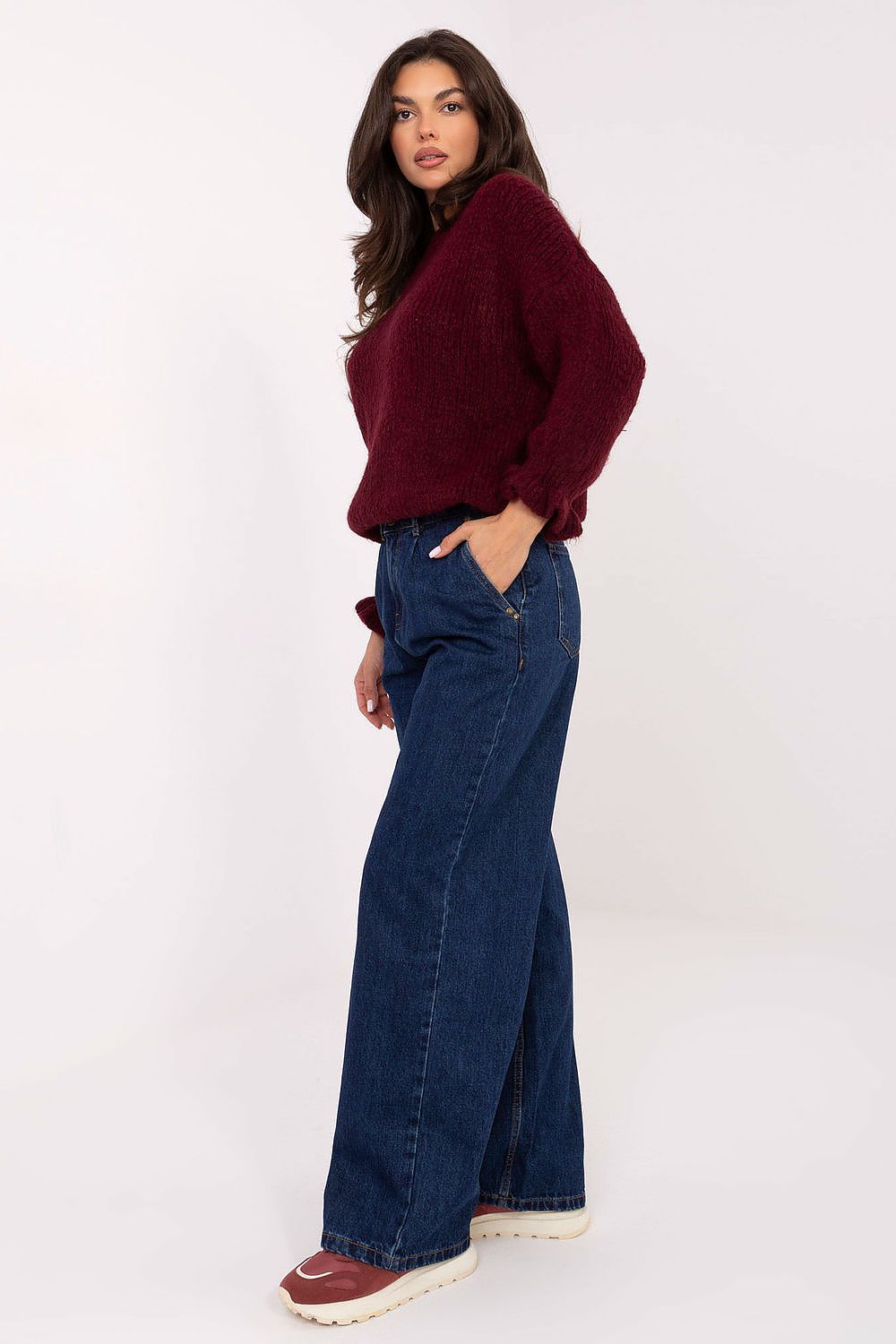 Luxury women's mom fit jeans by Sublevel crafted from high-quality cotton, featuring a wide leg design and subtle pleats for a feminine touch.