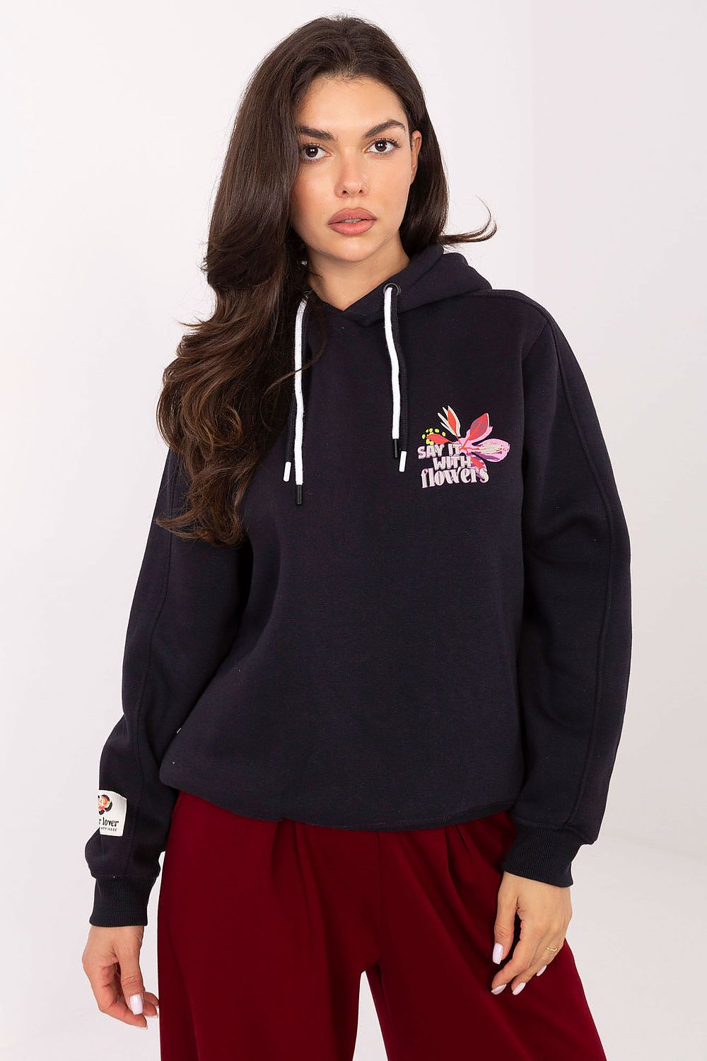 Sublevel women's luxury casual sweatshirt with hood and unique prints in a trendy design, showcasing the exquisite blend of comfort and style.
