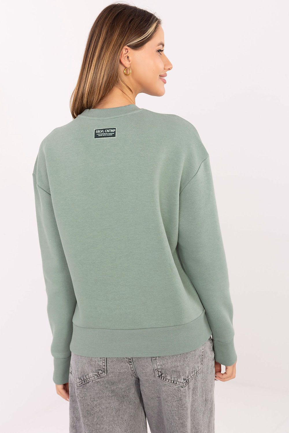 Close-up view of the high-quality embroidery on Sublevel's luxury women's casual cotton blend sweatshirt.