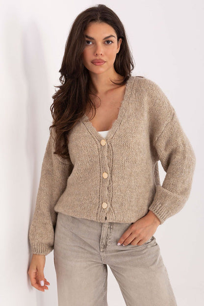 Stylish Rue Paris cardigan displayed on a mannequin, featuring a sophisticated V-neck design.