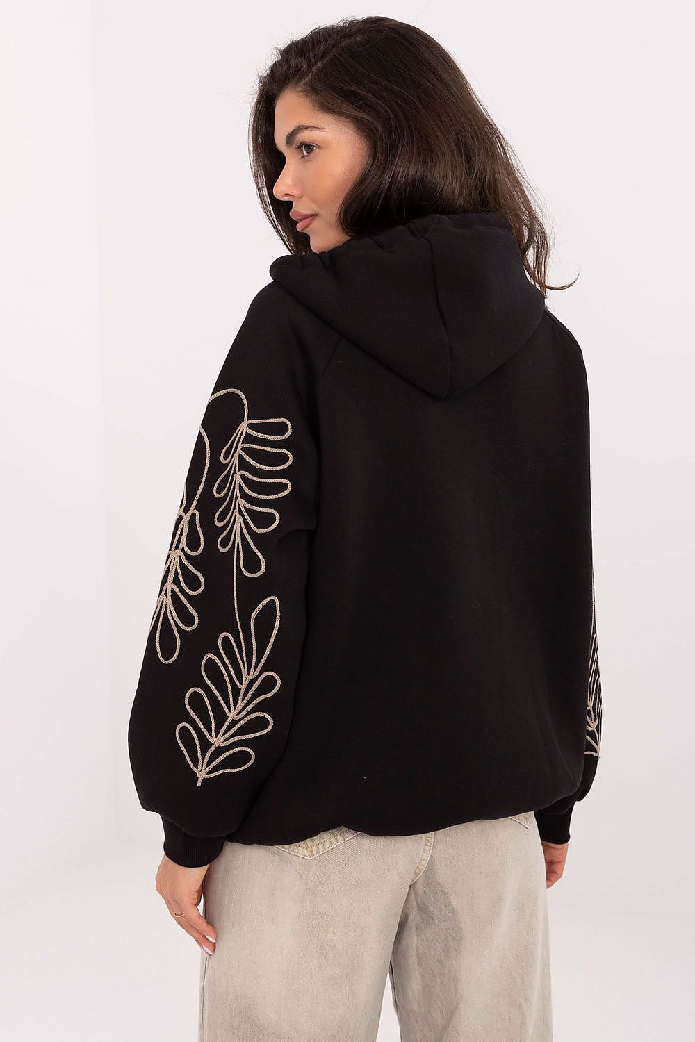 Trendy women's hoodie from Relevance, showcasing a relaxed fit and sophisticated zipping design, crafted for comfort and style.