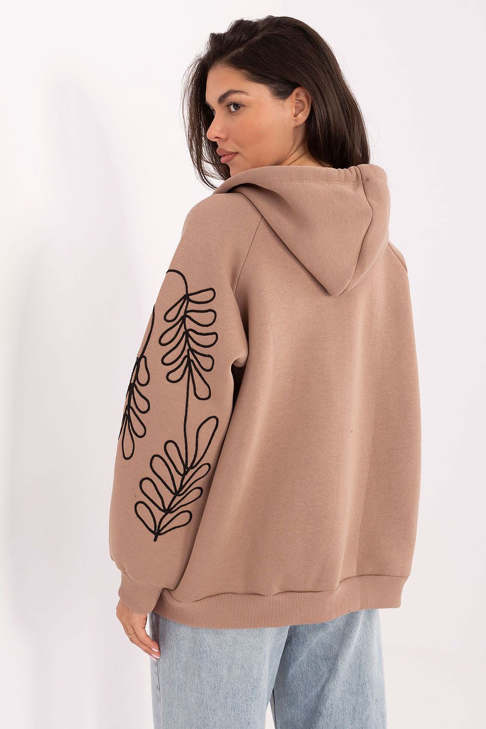 Chic women's hoodie with zipper closure by Relevance, showcasing practical pockets and an exquisite embroidery detail, ideal for a classy casual look.