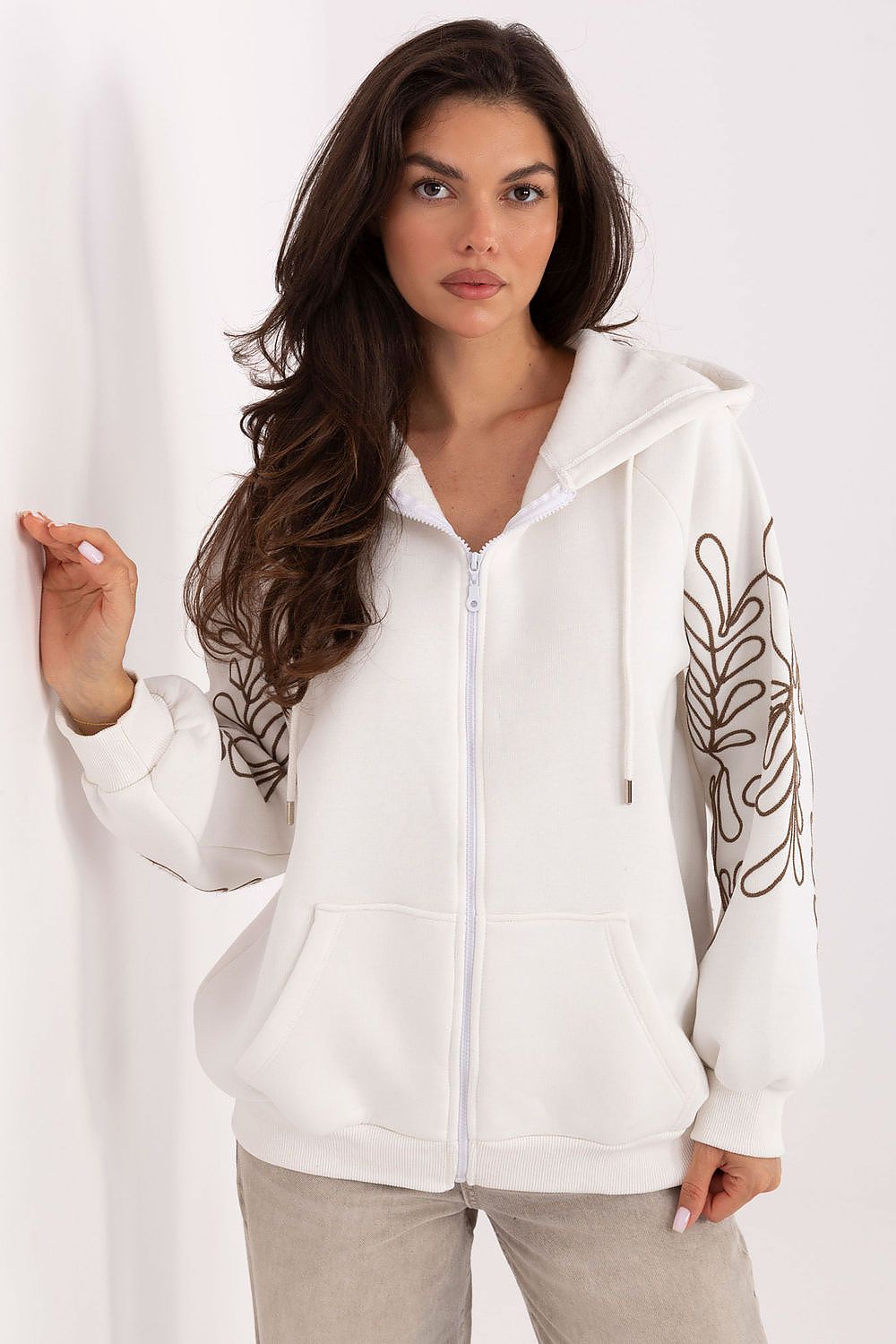 Elegant embroidered casual hoodie from Relevance, designed for modern women, offering comfort and style with a versatile zipper and essential front pockets.