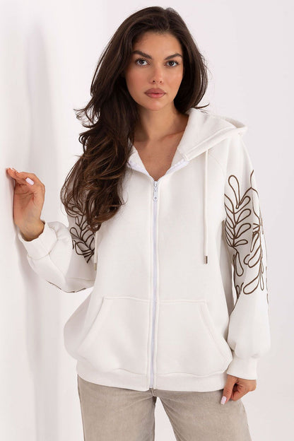 Elegant embroidered casual hoodie from Relevance, designed for modern women, offering comfort and style with a versatile zipper and essential front pockets.