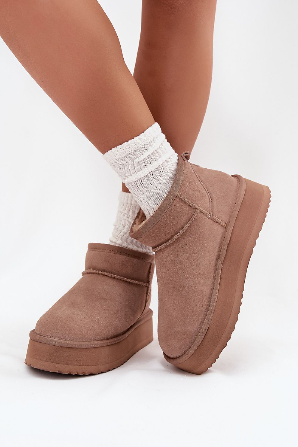 Fashionable Vinceza Women's snow boots in soft suede, designed for effortless slip-on wear during the cold months.