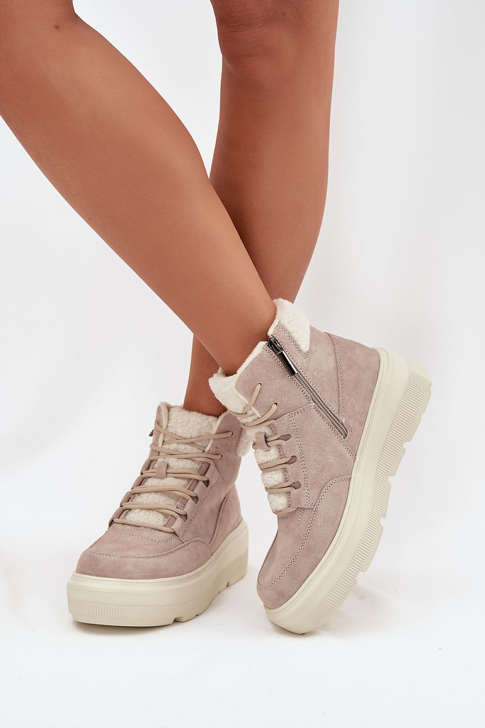 Chic and fashionable women's snow boots by Step in Style in luxurious suede, showcasing a comfortable fur lining and a robust platform.