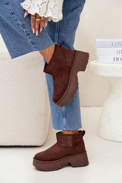 Chic faux suede winter boots featuring a comfortable fur lining and stylish platform heel, showcased by Step in Style.