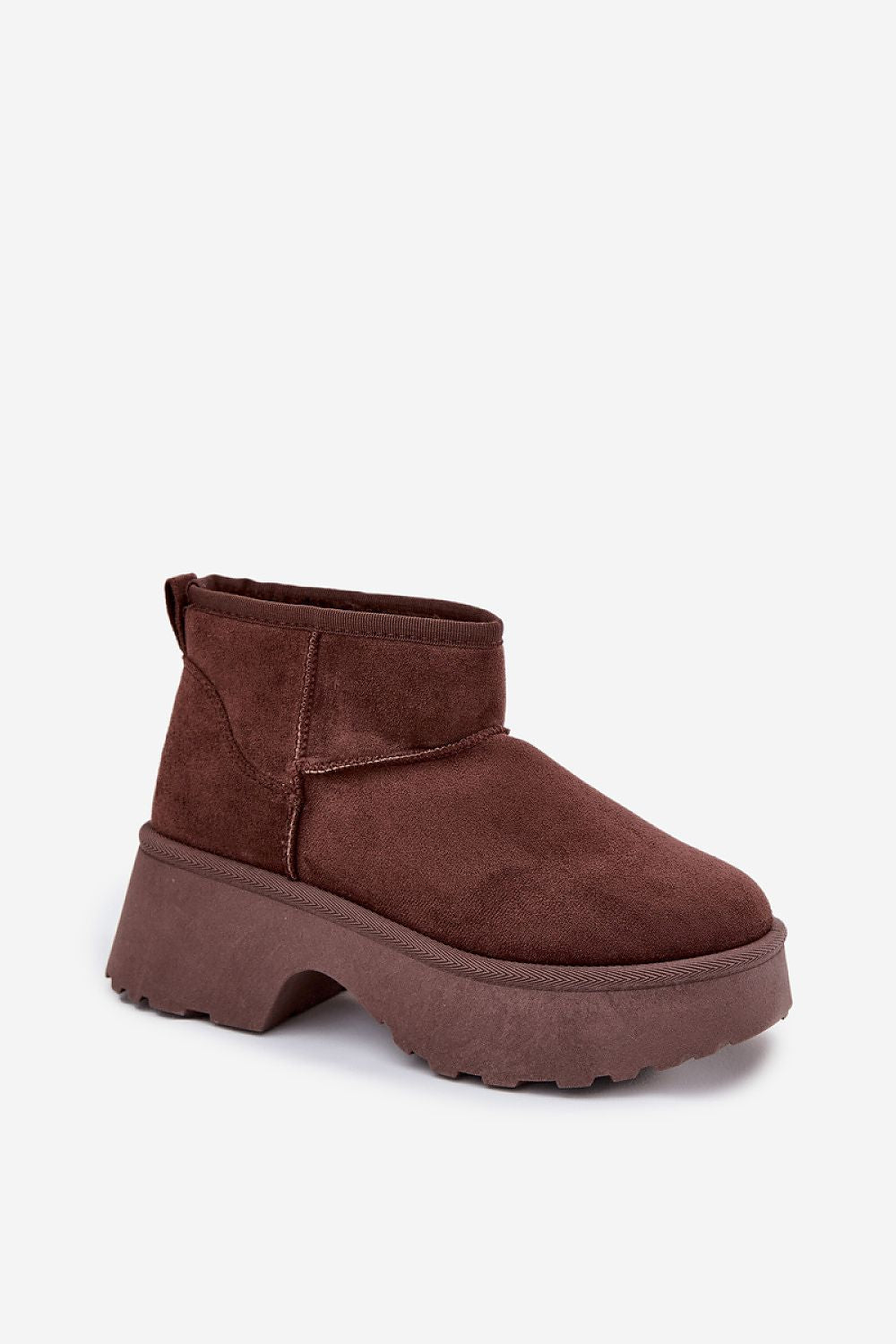 Luxury women's snow boots in faux suede with elevated platform and heel, designed for warmth and style by Step in Style.