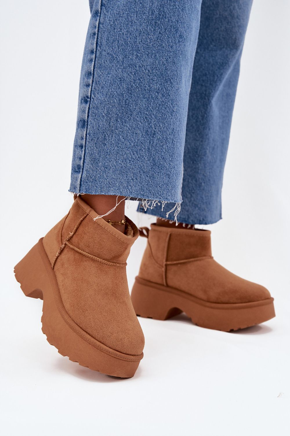 Sumptuous faux suede snow boots for women with stylish fur lining and heel height, brought to you by Step in Style.