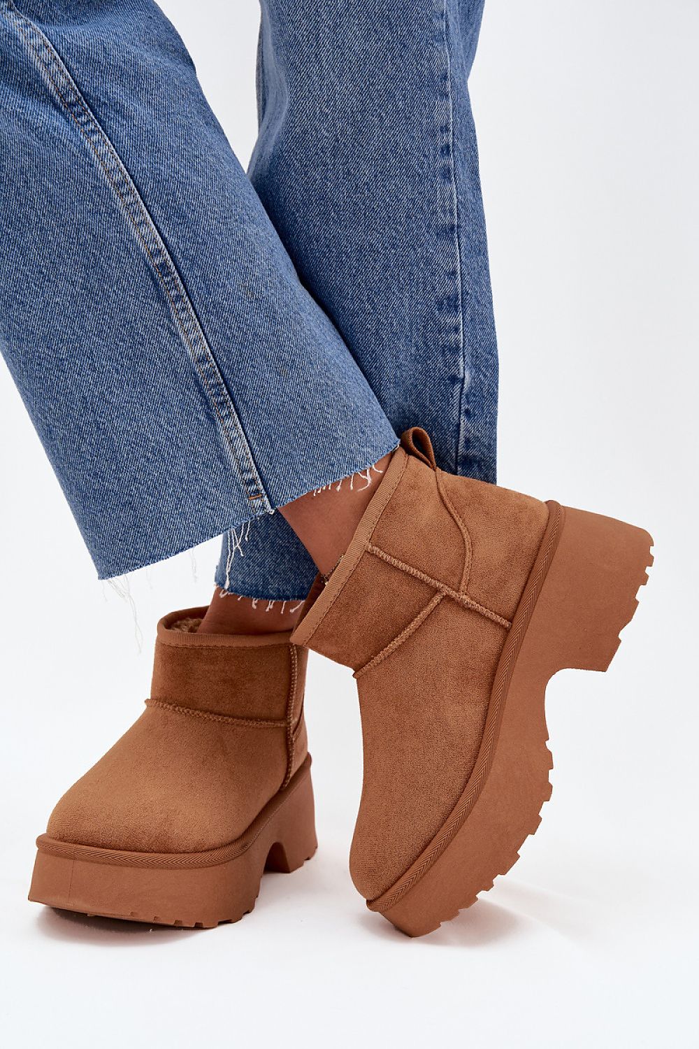 Step in Style women's snow boots made from luxurious faux suede and lined with warm fur for ultimate comfort during winter outings.