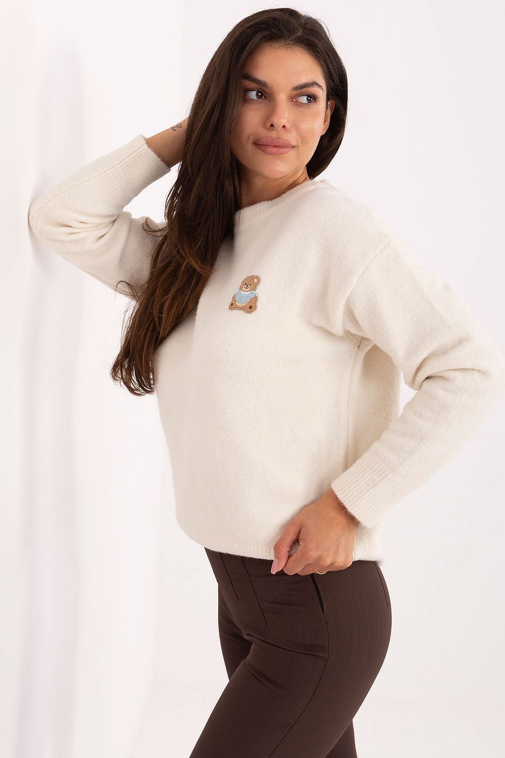 Luxurious round neckline women's sweater by Factory Price, made from a rich blend of materials, adorned with a delightful teddy bear patch on the chest.
