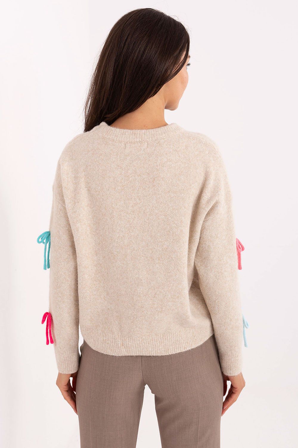 Close-up of the charming decorative bows on an elegant casual women's sweater, EU size 0, made by Factory Price from high-quality materials.