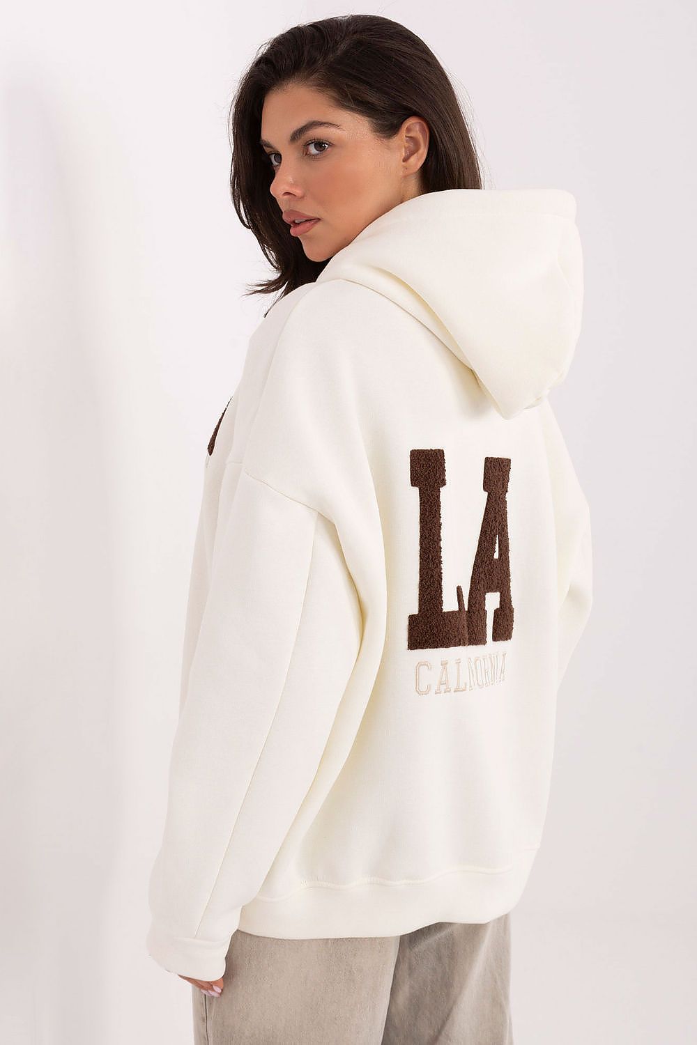 Stylish detail of the embroidered inscriptions on the Factory Price luxury cotton-polyester hoodie sweatshirt for women, showcasing contemporary design.