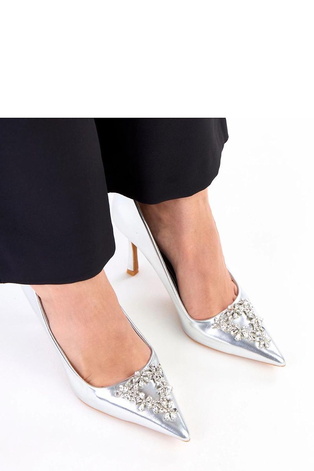 Elegant Solea patent leather stilettos showcasing a sleek pointed toe design, adorned with sparkling zircon details, perfect for enhancing formal outfits.
