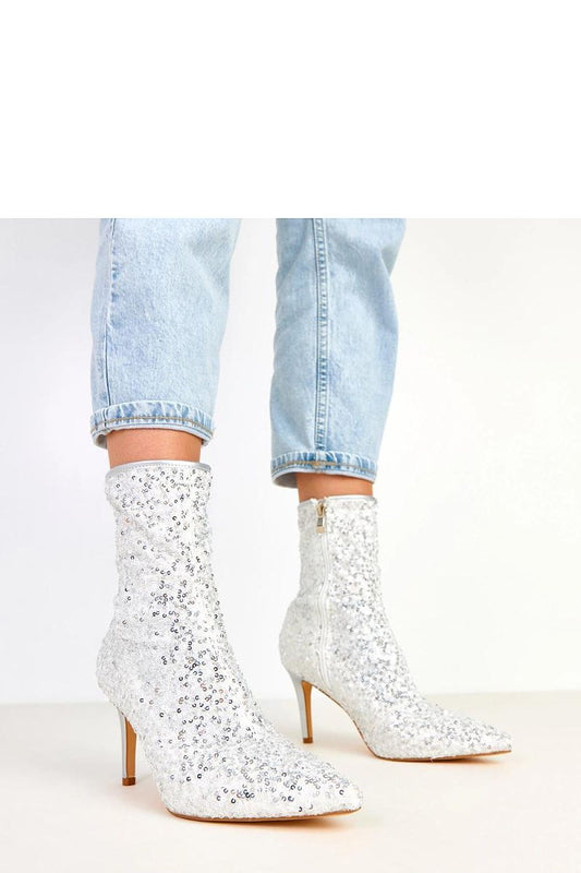 Elegant Solea ankle boots for women with a sequin finish, featuring a pointed toe and 8.5 cm stiletto heel, perfect for luxurious evenings.