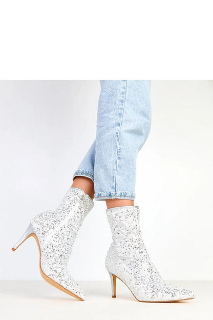 Side view of Solea sequin ankle boots showcasing the stylish pointed toe and 18 cm high shaft, ideal for chic outfits.