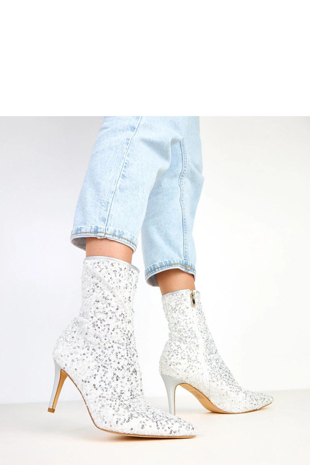 Close-up of Solea women's ankle boots highlighting the glamorous sequin detail and sophisticated design, tailored for a stunning look.